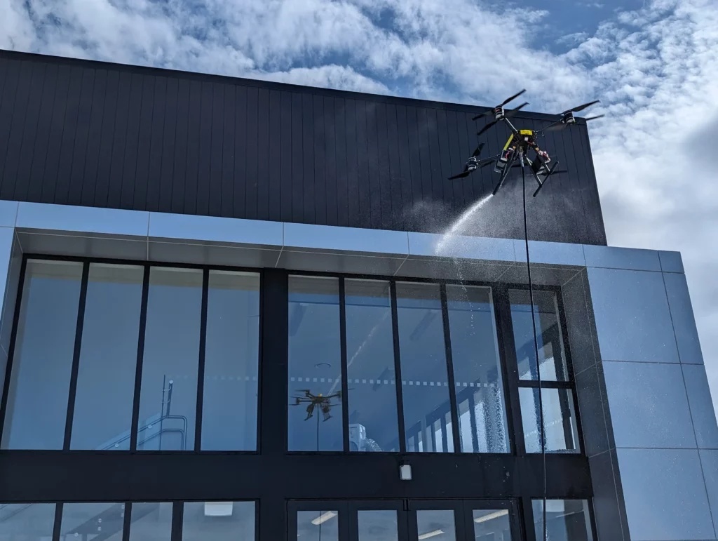 Commercial roof and gutter drone cleaning on a modern commercial building in Liverpool